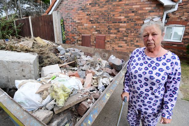 Andrea Calland after builders left her house unfinished