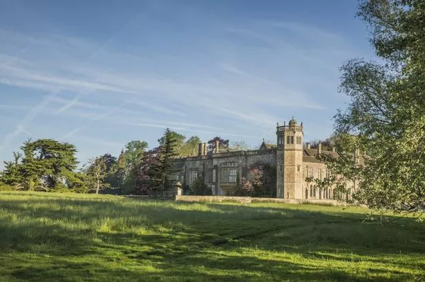 Distant view of the house across the fields at Lacock Abbey