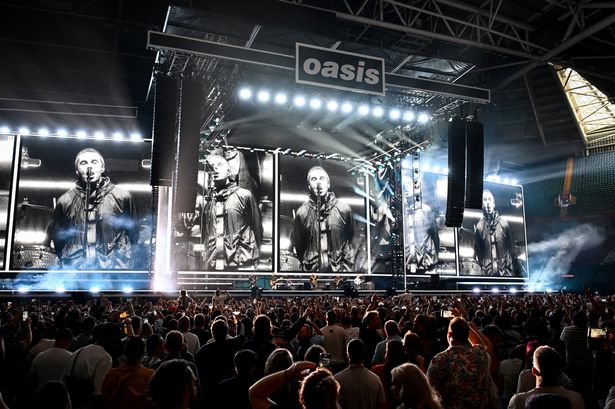 Oasis perform on stage during the opening night of their Live 25' Tour at Principality Stadium on July 04