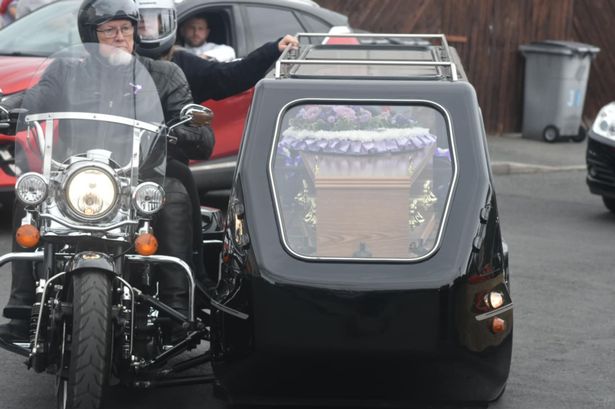 Robert Green arriving at his funeral with older sister Bree'ann accompanying him on the motorcycle