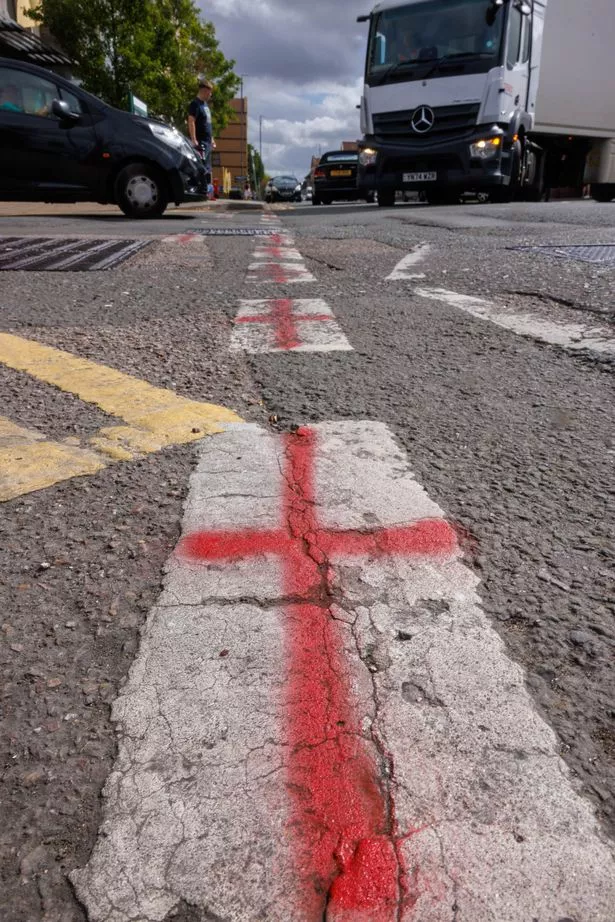 St George cross has appeared on crossings and road markings across the country,  Tuesday 26 August 2025 , this in Staple Hill in Bristol is found on white lines on the High Street