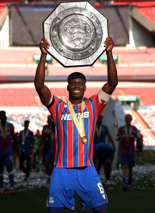 LONDON, ENGLAND - AUGUST 10: Marc Guehi of Crystal Palace holds the Charity Shield after their win during the 2025 FA Community Shield match between Crystal Palace and Liverpool at Wembley Stadium on August 10, 2025 in London, England. (Photo by Julian Finney/Getty Images)