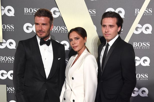 David Beckham and Victoria Beckham with son Brooklyn