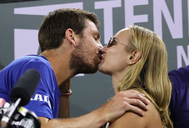 Cameron Norrie of Great Britain kisses his girlfriend Louise Jacobi after his three set victory against Nikoloz Basilashvili of Georgia in the men's final match on Day 14 of the BNP Paribas Open at the Indian Wells Tennis Garden on October 17, 2021 in Indian Wells, California
