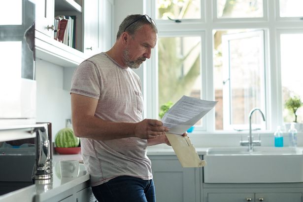 Man reading a letter