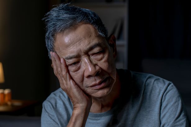 Man struggling to sleep