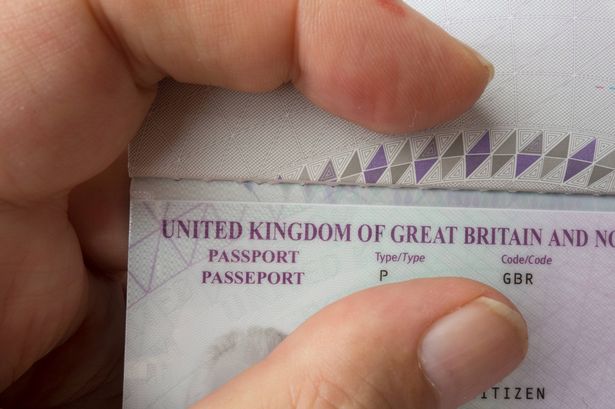 United Kingdom, Europe - August 10, 2024: Person Holding UK Passport