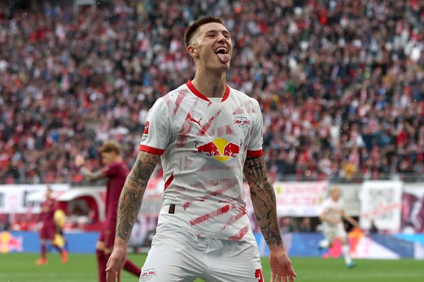 Benjamin Sesko celebrates after scoring for RB Leipzig.