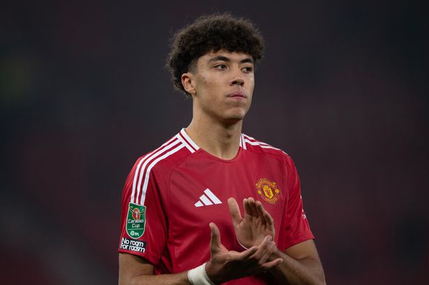Ethan Wheatley applauds after a game at Old Trafford.