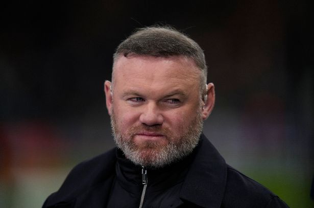 Wayne Rooney looks on