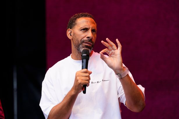 Rio Ferdinand speaks at an event.