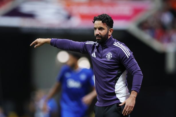 Ruben Amorim points out an instruction from the touchline.