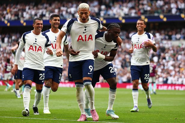Richarlison celebrates with his Tottenham teammates after scoring against Burnley