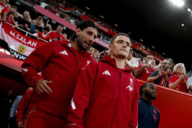 Dominik Szoboszlai and Florian Wirtz of Liverpool talk as they take to the pitch prior to the Premier League match against Bournemouth at Anfield on August 15 2025