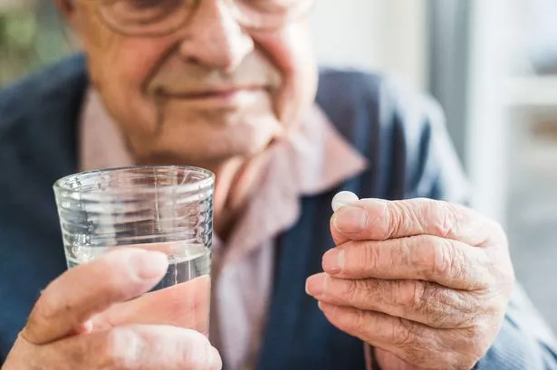 Man taking tablet
