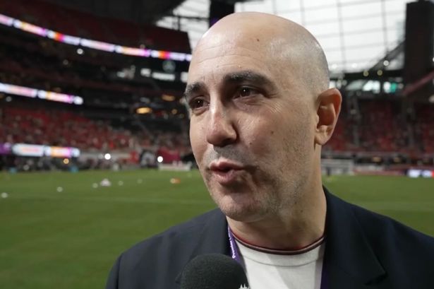 Omar Berrada is interviewed on the pitch at the Mercedes-Benz Stadium.