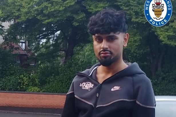 Family issued photo of Ismail Younis, 24, pictured with dark hair and a beard and wearing a black and grey Nike tracksuit 