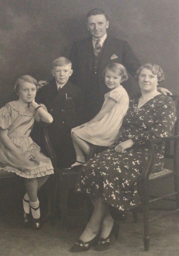 The Harper family who had a dairy on Rose Lane, Mossley Hill. Pictured, Joan Fenney, nee Harper, on her mum Doris' knee, next to dad Edward and siblings Thomas and Olive