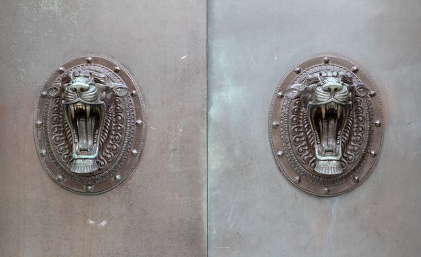 Tigers heads on old bank in Water Street