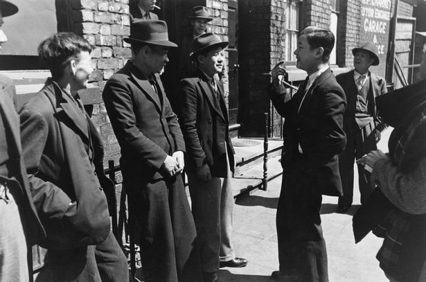 A group of Chinese seamen outside a Chinese hostel in Liverpool, May 1942
