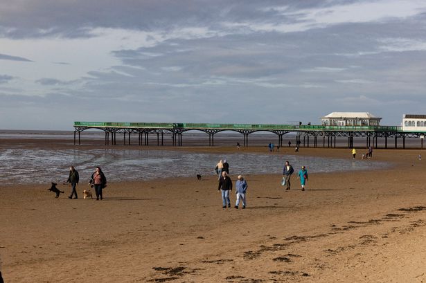 People enjoy a walk on the beach with St Anne's Pier in the distance at South Promenade, Lytham St Annes, Lancashire.
Photo by James Maloney/LancsLive