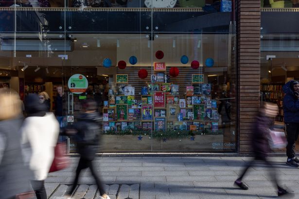 Shoppers walk by Waterstones in Birmingham city centre