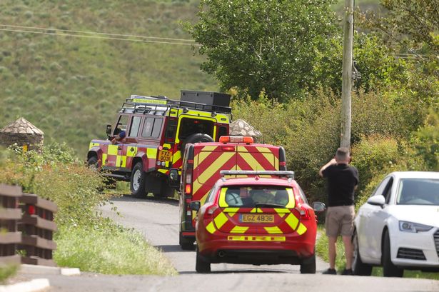 Emergency services at the scene on The Rylagh Road outside Omagh, Co. Tyrone, where they are dealing with the discovery of a body.