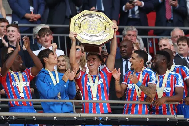 Justin Devenny of Crystal Palace holds aloft the FA Community Shield 
