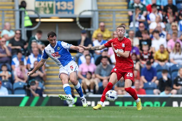 Blackburn Rovers' Dominic Hyam passes the ball under pressure from Birmingham City's Jay Stansfield