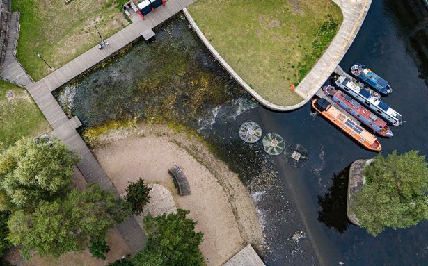 An aerial view of the low water levels at New Islington Marina in Manchester City Centre which has caused some boats to be stuck