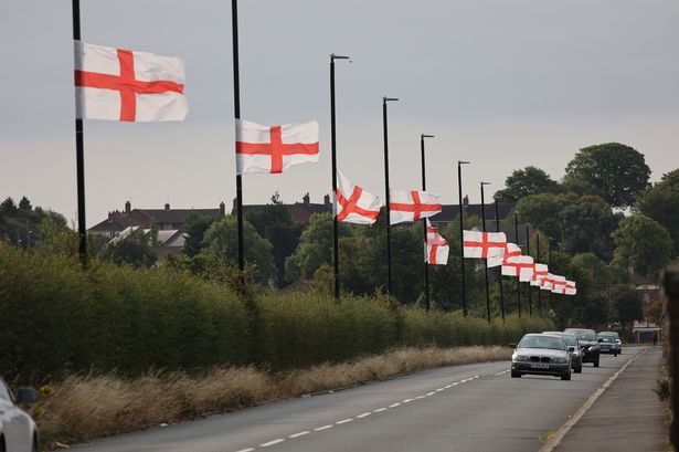England flags flying on lampposts on Genners Lane along Bartley Reservoir , Bartley Green Birmingham. 