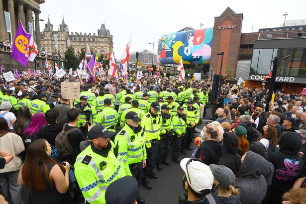 Police keep both sides apart at the UKIP rally.