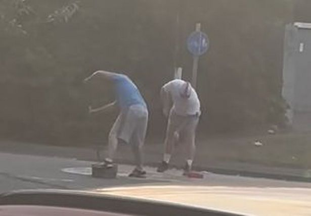 Two men were filmed painting a St George's cross on a mini-roundabout in the Bentley area of Walsall