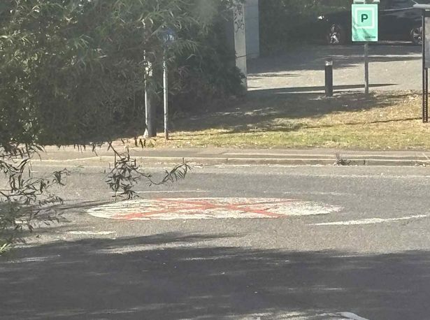 Two men were filmed painting a St George's cross on a mini-roundabout in the Bentley area of Walsall