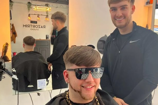 Barber Ben McCabe giving Ollie Stokes, 17, the Ibiza Final Boss cut

