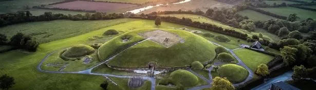 The Megalithic Passage Tombs of Newgrange and Knowth at sunset