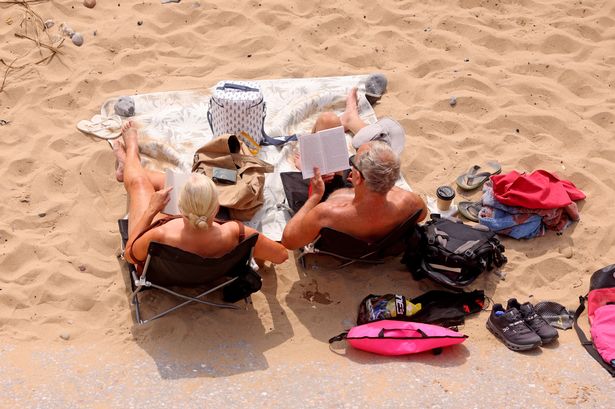 People relax on a beach