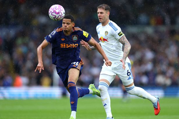 Newcastle United's William Osula (left) and Leeds United's Joe Rodon battle for the ball 