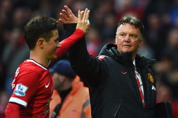 Louis van Gaal manager of Manchester United celebrates victory with Ander Herrera