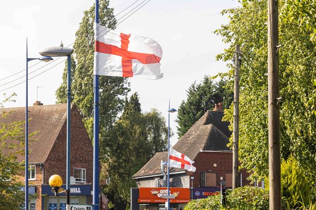 St George’s and Union Jack flags tied to lamp posts around Weoley Castle.