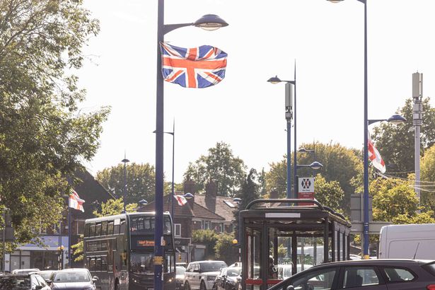 St George’s and Union Jack flags tied to lamp posts around Weoley Castle.