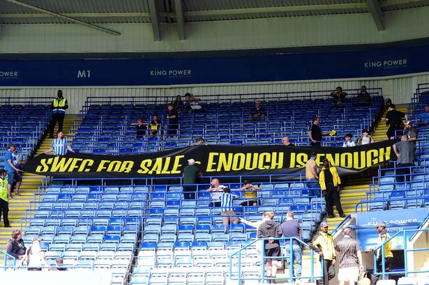 Sheffield Wednesday fans in the stands protest against club owner Dejphon Chansiri ahead of the Sky Bet Championship match at the King Power Stadium, Leicester