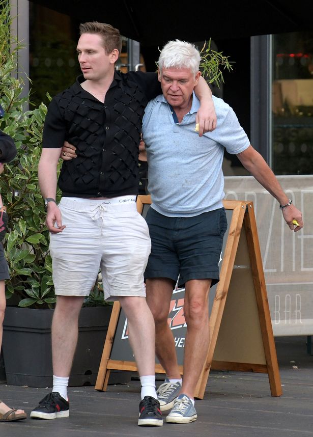 Phillip Schofield and a companion outside a bar in London.