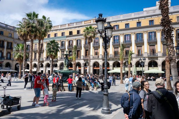BARCELONA, SPAIN - 2025/06/09: People are seen walking near the Plaza Real, adjacent to the tourist area of Las Ramblas. Located on the northeast coast of Spain, Barcelona is a vibrant and cosmopolitan city on the shores of the Mediterranean Sea. Capital of Catalonia, it stands out for its rich cultural heritage, its modernist architecture. The city combines history, innovation and tradition in a unique Mediterranean setting that attracts visitors from all over the world. (Photo by Jorge Castellanos/SOPA Images/LightRocket via Getty Images)