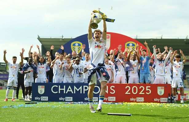 PLYMOUTH, ENGLAND - MAY 03: Harry Gray of Leeds United celebrates with the Sky Bet Championship trophy after the teams 2-1 victory, which confirmed that the team has won the Sky Bet Championship and promotion to the Premier League following the Sky Bet Championship match between Plymouth Argyle FC and Leeds United FC at Home Park on May 03, 2025 in Plymouth, England. (Photo by Harry Trump/Getty Images)