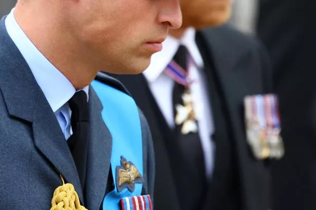 The Duke of Sussex (right) and Prince of Wales , arrive at the State Funeral of Queen Elizabeth II
