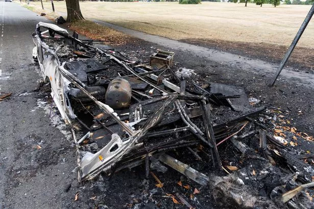 The caravan was 'deliberately' set ablaze on Clifton Downs in Bristol - where dozens of people live in more than 100 vans