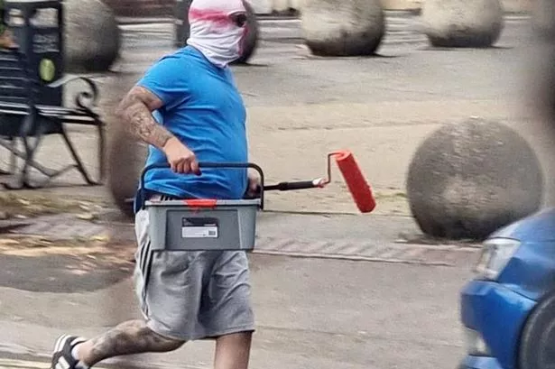 The two men were seen running through the streets of Walsall clutching pots of paint and paint rollers over the weekend