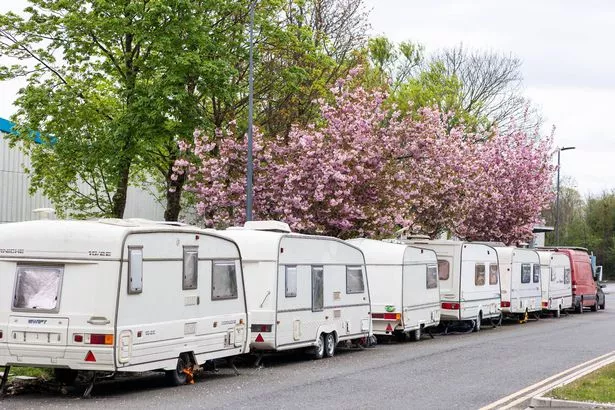 The caravan was 'deliberately' set ablaze on Clifton Downs in Bristol - where dozens of people live in more than 100 vans