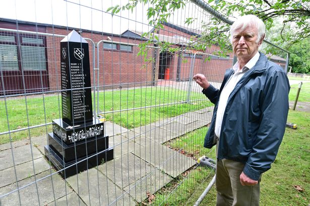 John Herbert with the fenced off Scarisbrick World War 1 Memorial, at The Venue (Village Hall)